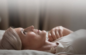 woman lying in bed coping with grief